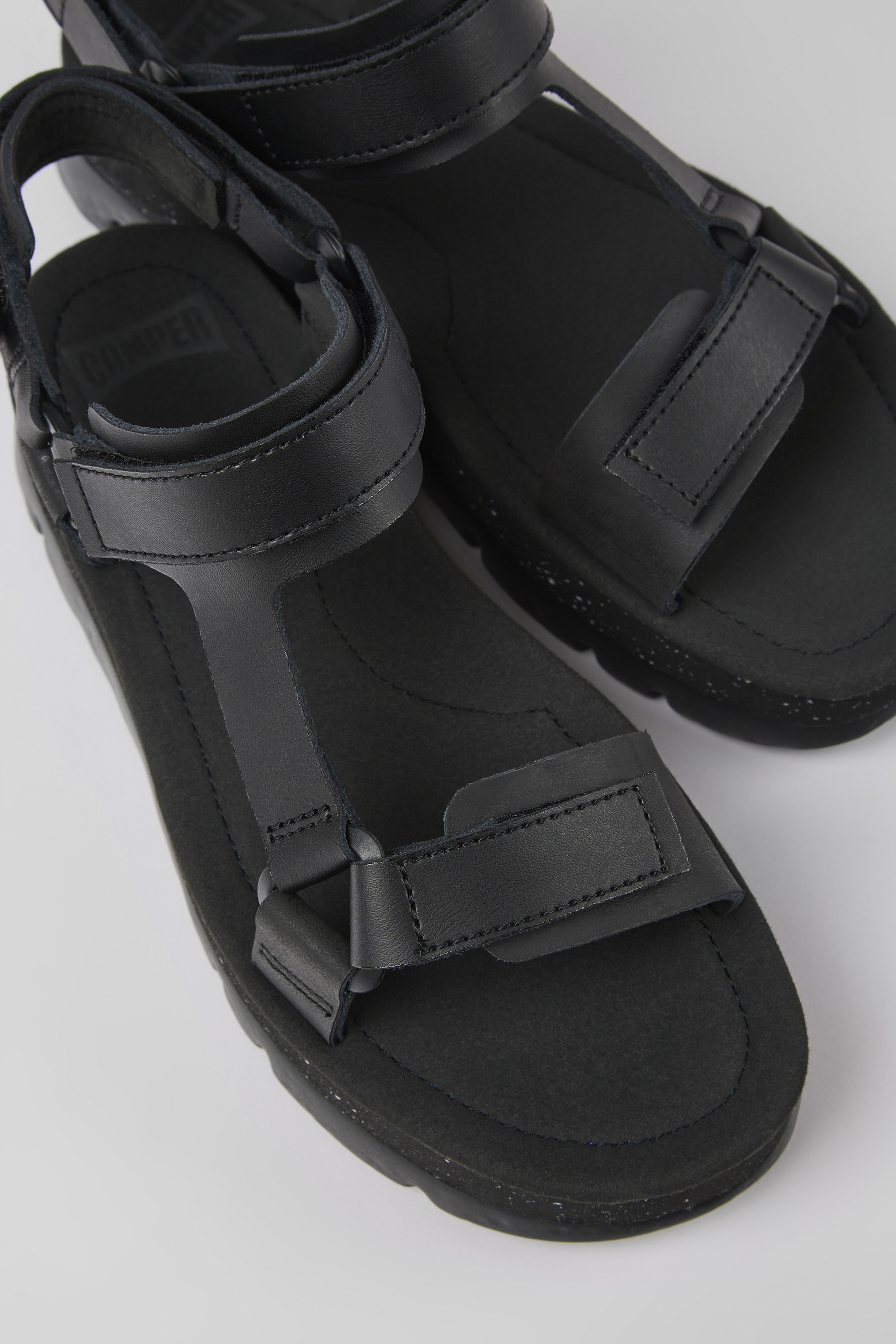 Oruga Up - Black leather sandals for women