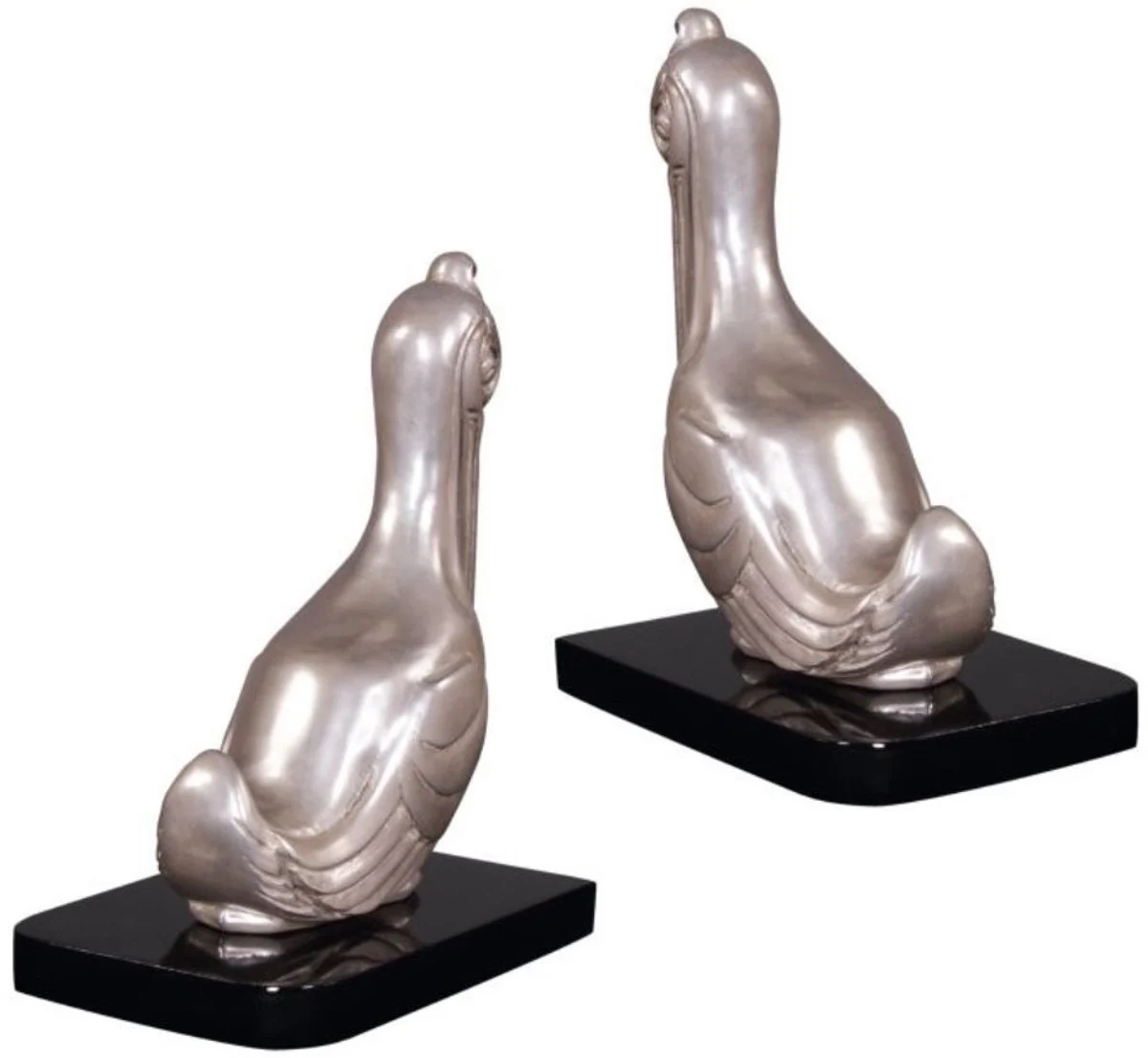 Casa Padrino conjunto de sujetalibros de lujo pelícanos plata / negro 18 x 12 x H. 22 cm - Figuras de Bronce Plateado Decorado con Base de Madera