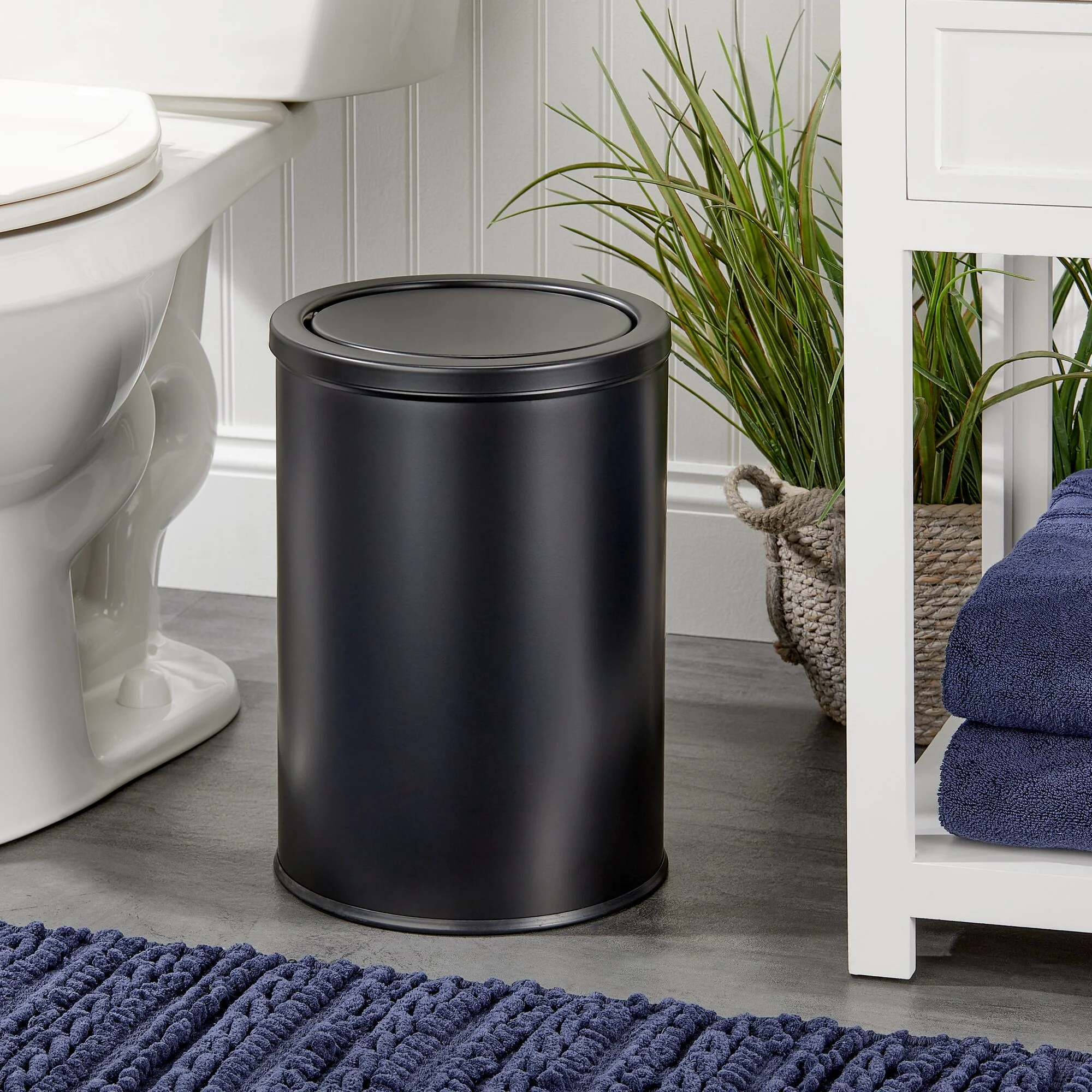 mDesign Small Round Metal 4.8 Gallon Covered Bathroom Swing Lid Trash Can, Black