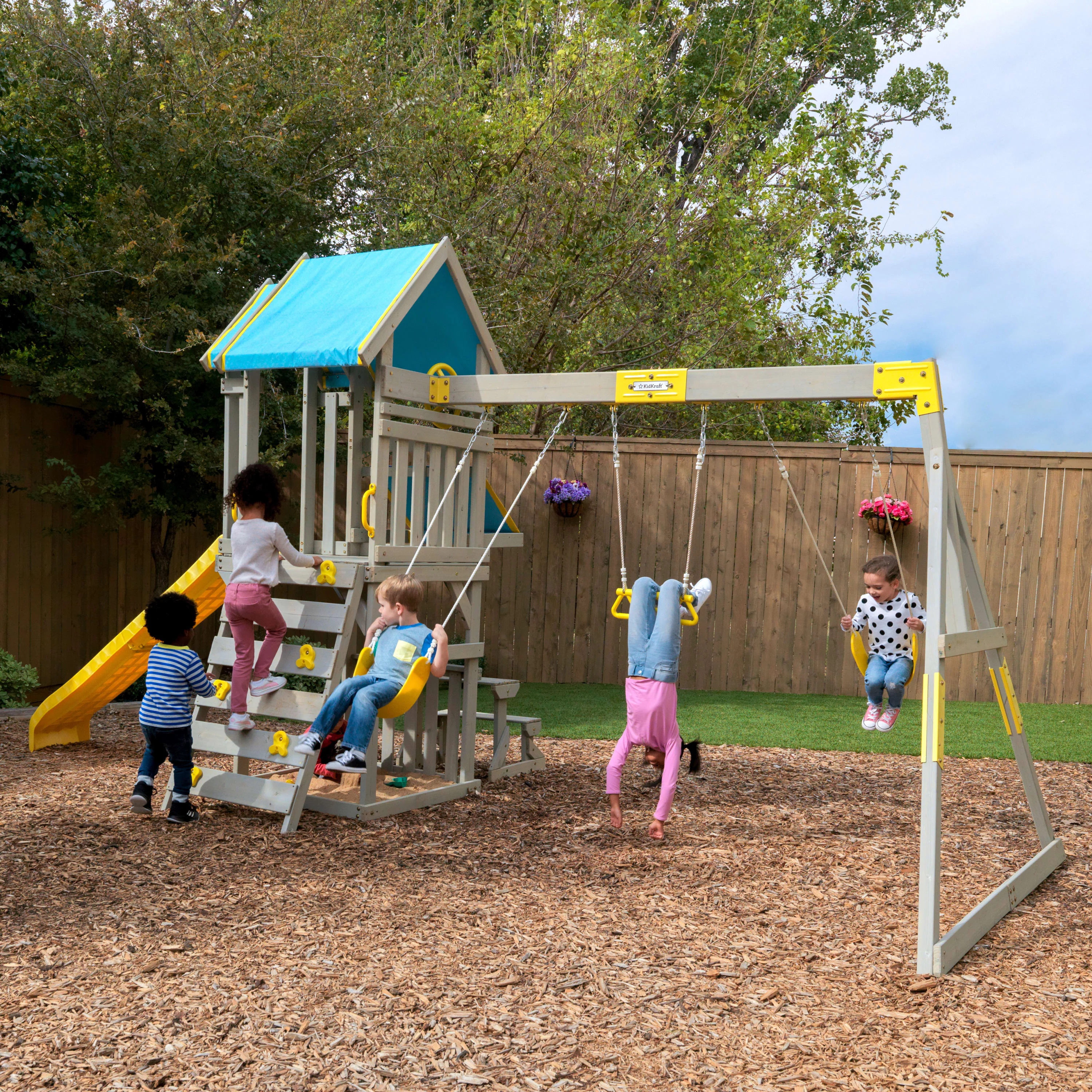 KidKraft Seacove Wooden Swing Set / Playset with Table & Bench, Blue and Yellow, For Ages 3-10