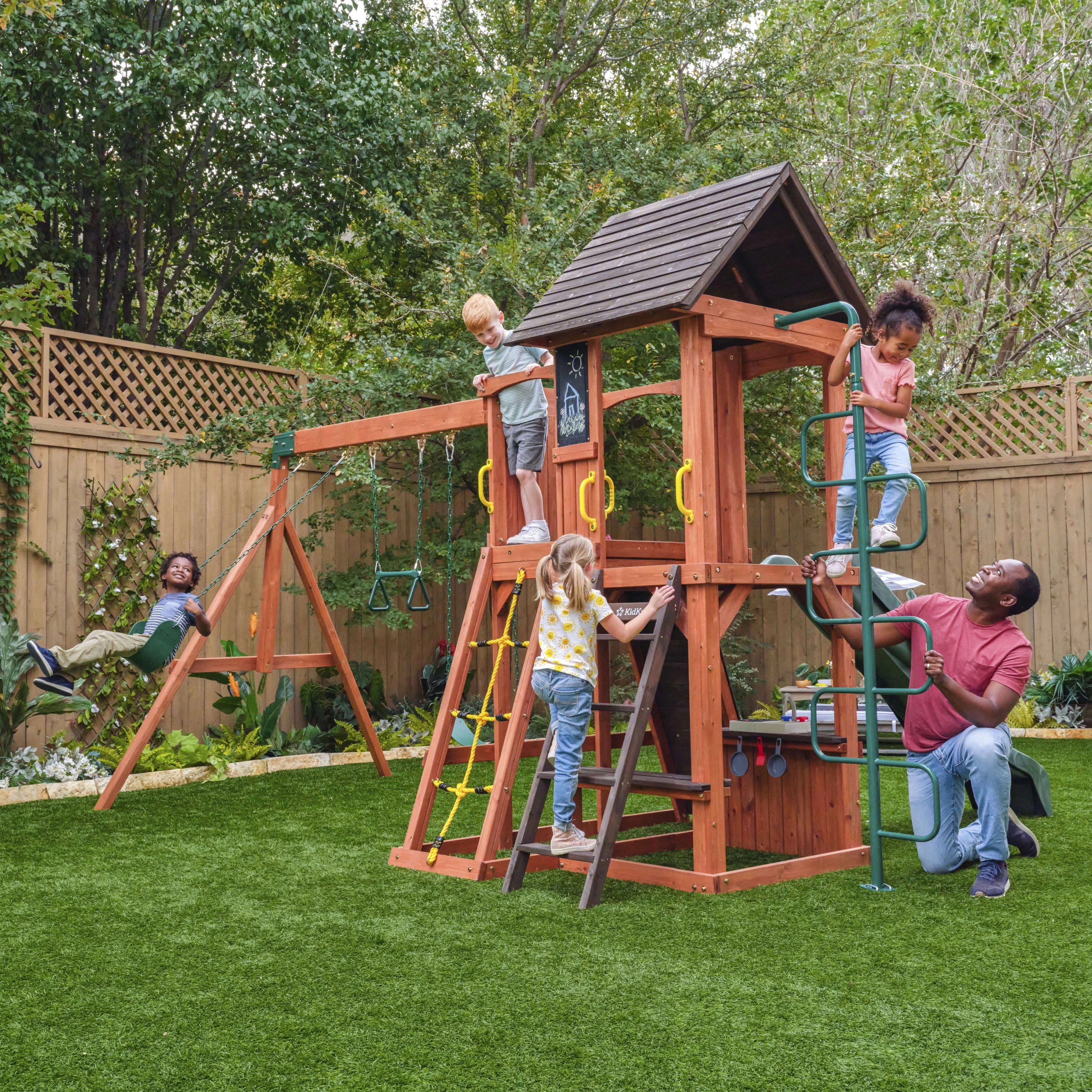 KidKraft Raptor Trail Wooden Outdoor Swing Set with Wavy Slide and Rock Wall, For Ages 3-10