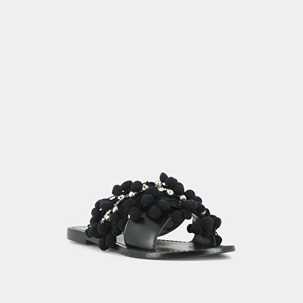 MULES IN BLACK LEATHER AND TEXTILE