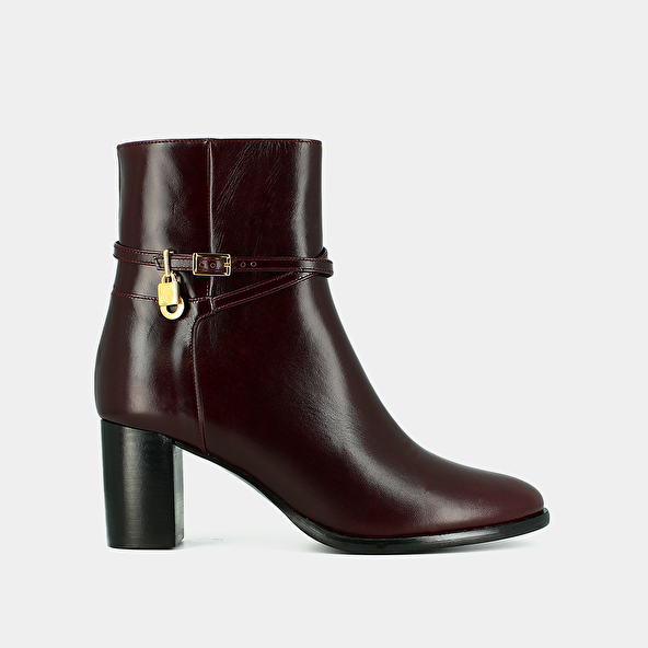 BOOTS WITH HIGH HEELS AND GOLD CHARMS