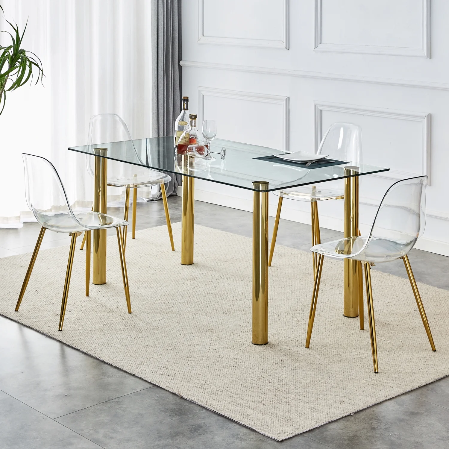 Upgrade your Dining Room with Luxurious T-003 TW-1200 4-Piece Dining Set featurning Crystal Clear Tempered Glass Tabletop and Gold-Plated Metal Legs. This set includes Modern Armless Chai