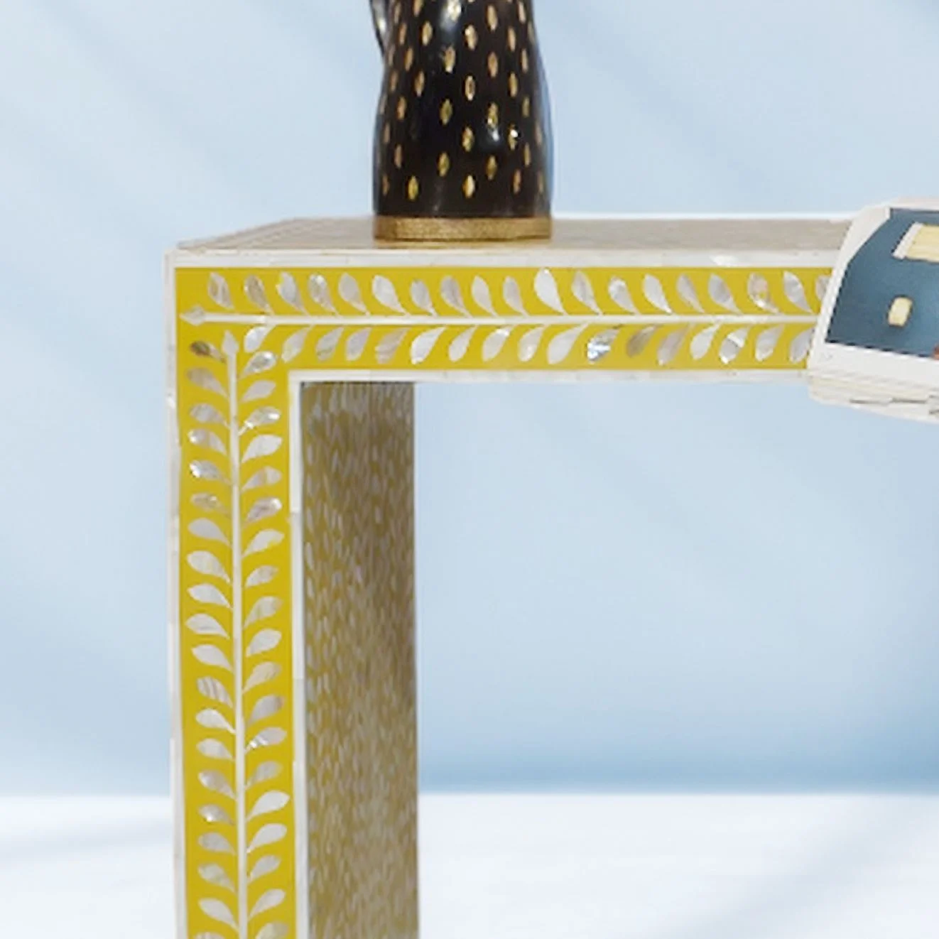 Yellow Console Table adorned in a leaf pattern of exquisite Mother of Pearl work