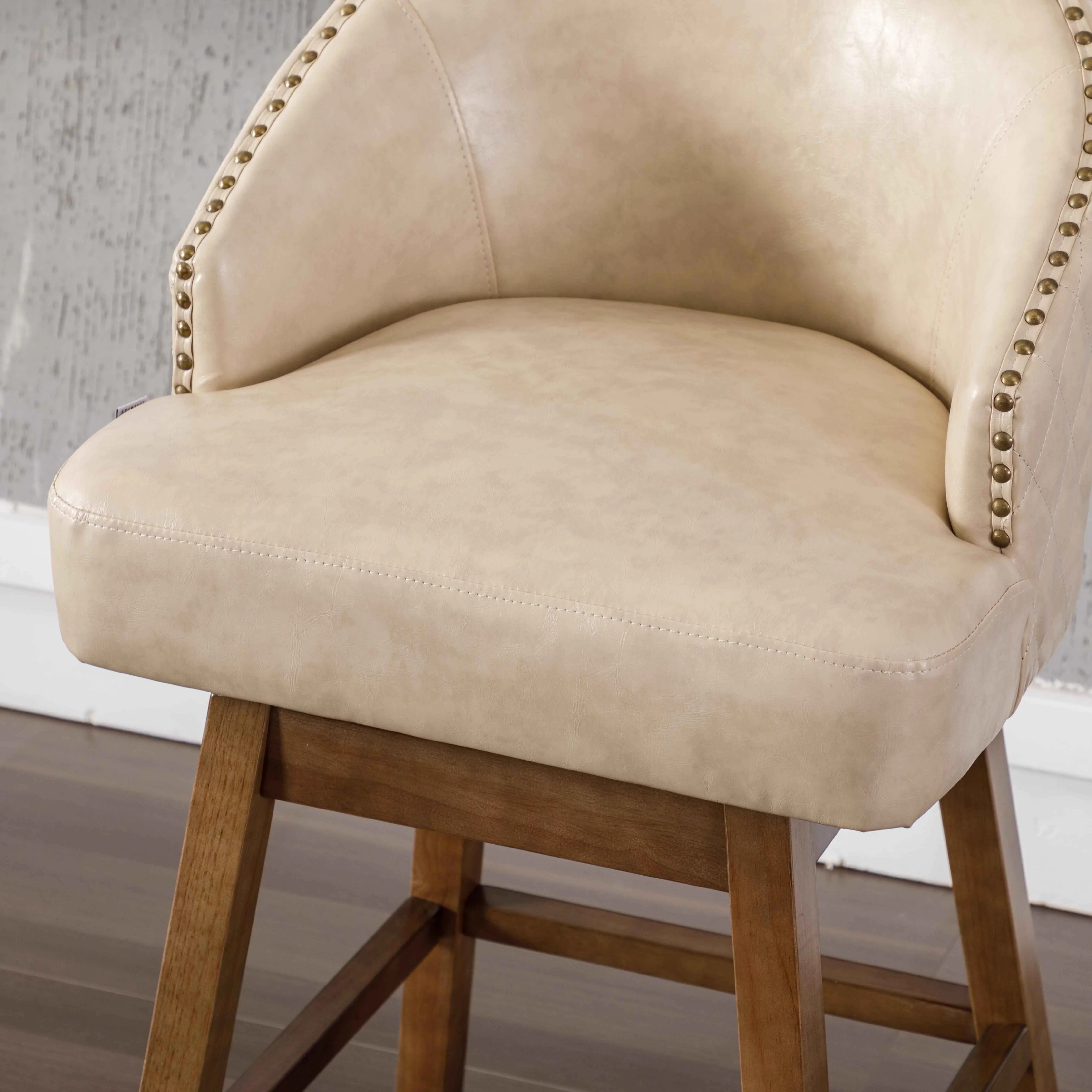 Upholstered Bar Stools, Counter Height 360 Degree Swivel Bar Stool Chairs with Solid Wood Legs Kitchen Island Padded Barstools with Nailhead Trim and Footrest(Apricot PU,Set of 2)