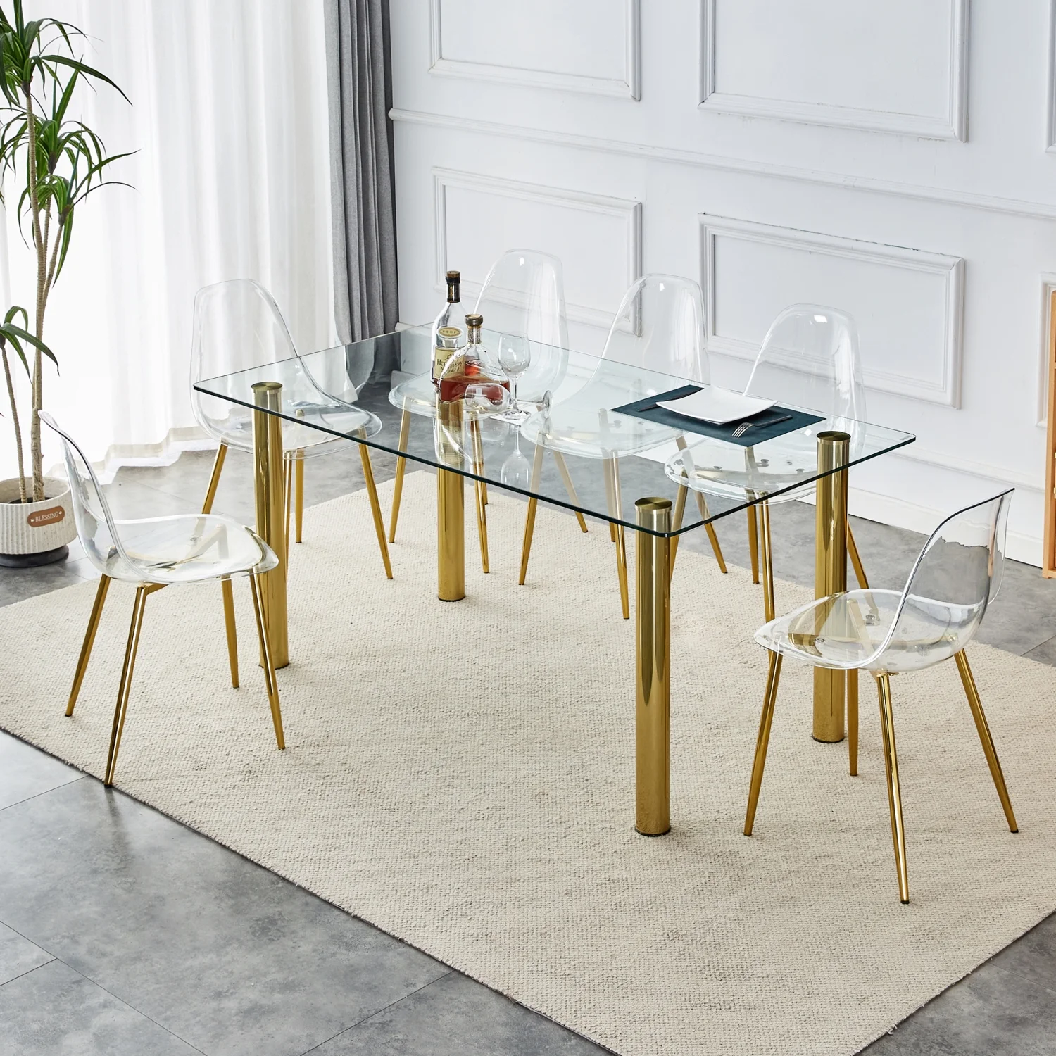 Upgrade your Dining Room with Luxurious T-003 TW-1200 4-Piece Dining Set featurning Crystal Clear Tempered Glass Tabletop and Gold-Plated Metal Legs. This set includes Modern Armless Chai