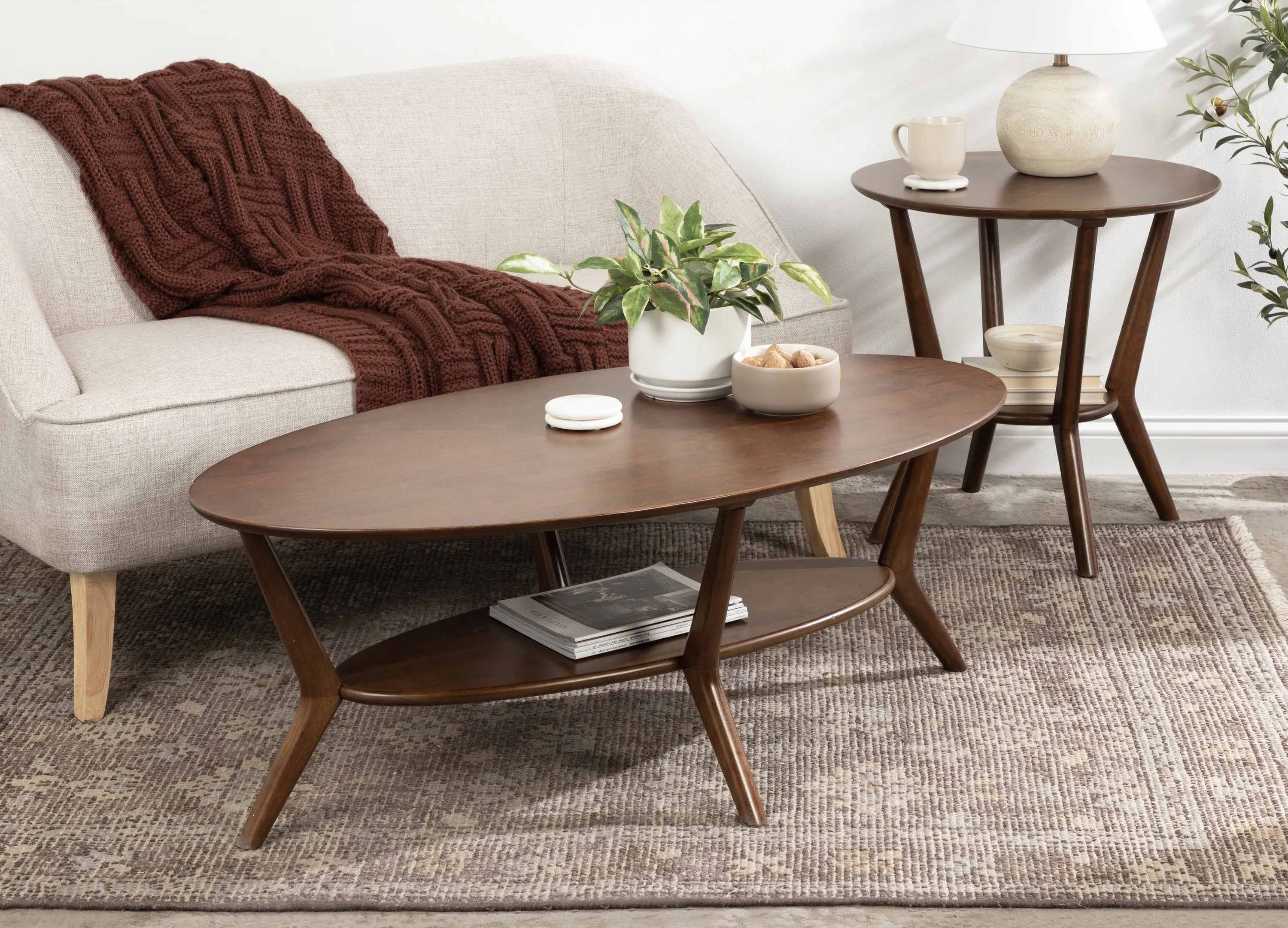 Kate and Laurel Nylah Oval Wooden Coffee Table, 48 x 26 x 18, Walnut Brown, Mid-Century Tiered Living Room Table with Solid Wood Construction and Sculptured Dowel Legs