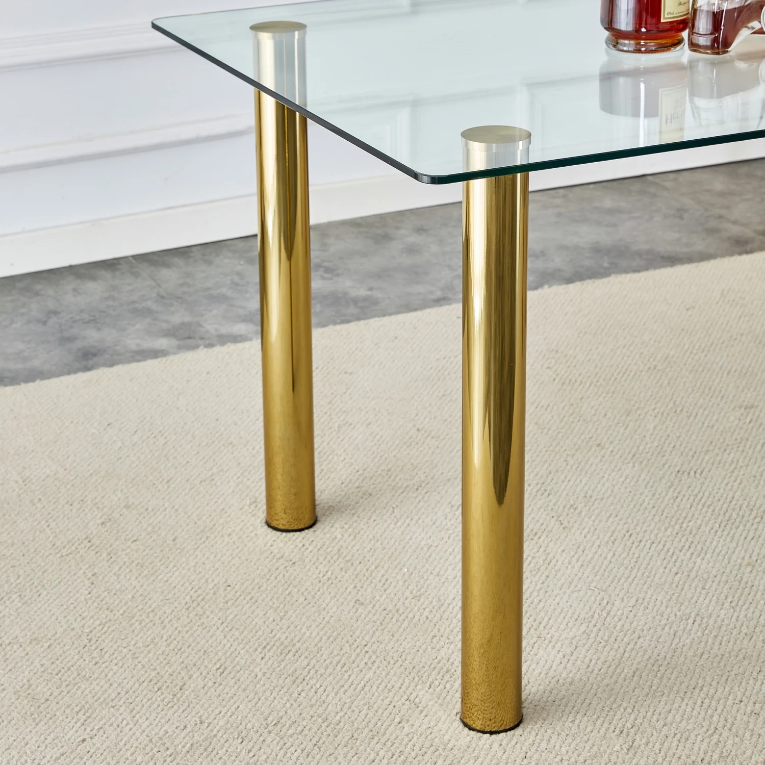 Upgrade your Dining Room with Luxurious T-003 TW-1200 4-Piece Dining Set featurning Crystal Clear Tempered Glass Tabletop and Gold-Plated Metal Legs. This set includes Modern Armless Chai