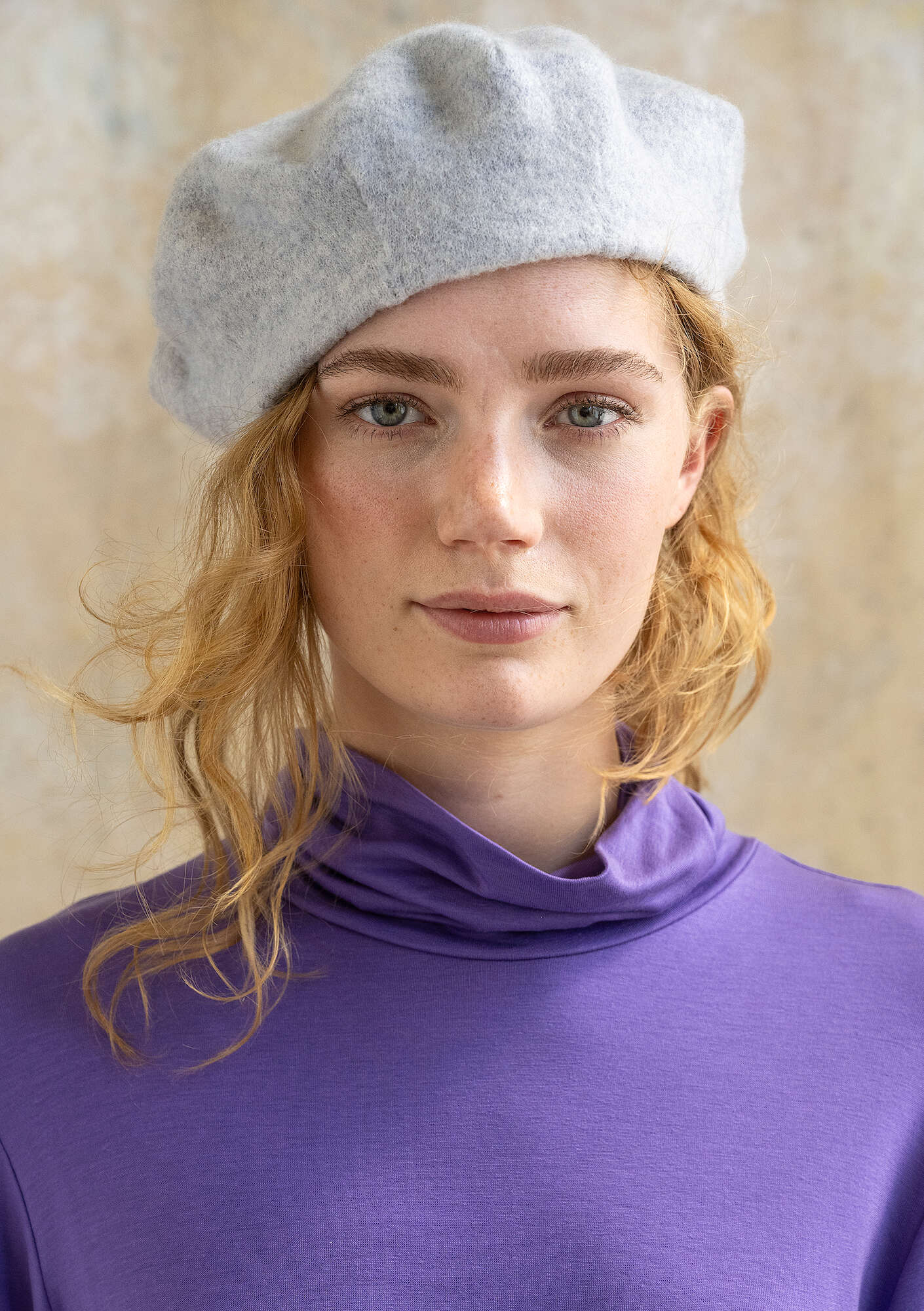 Knitted beret in felted organic wool