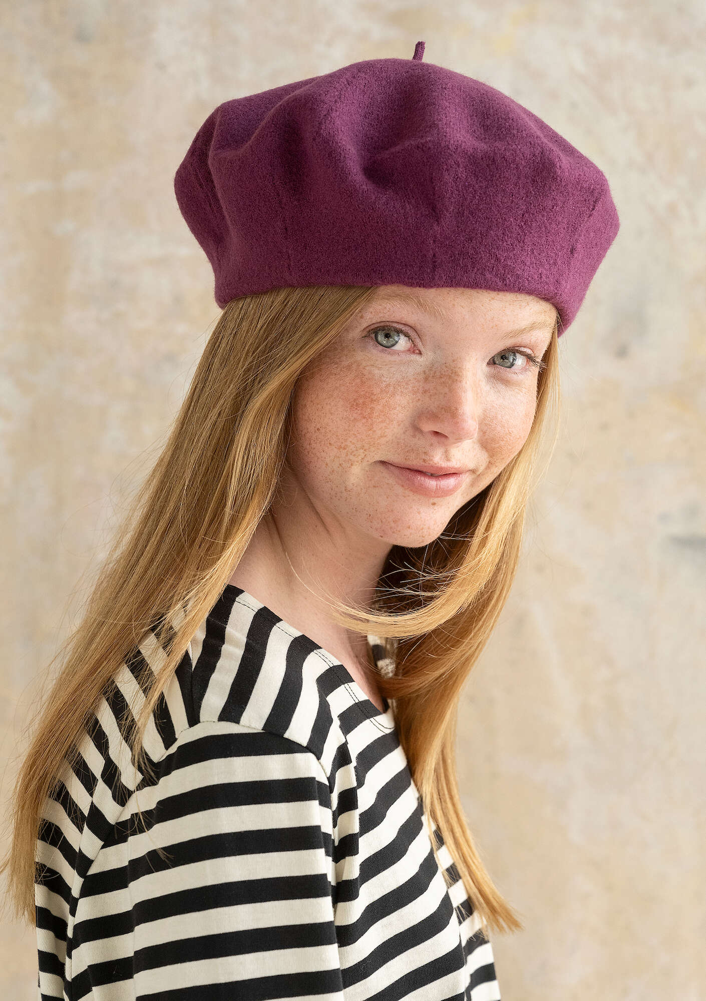 Knitted beret in felted organic wool