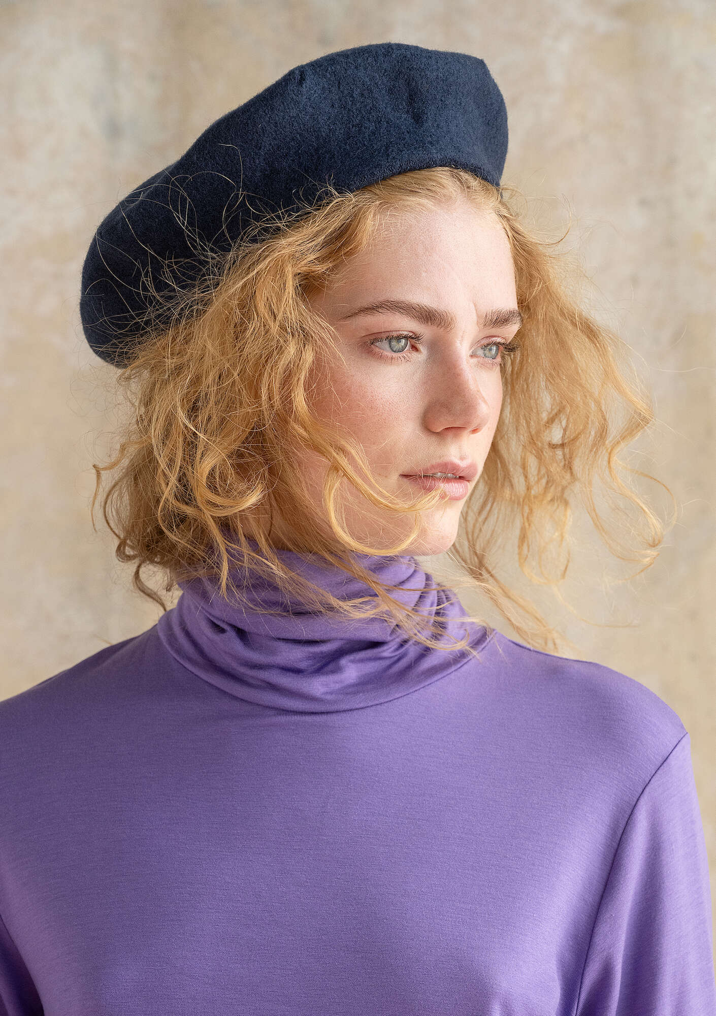 Knitted beret in felted organic wool