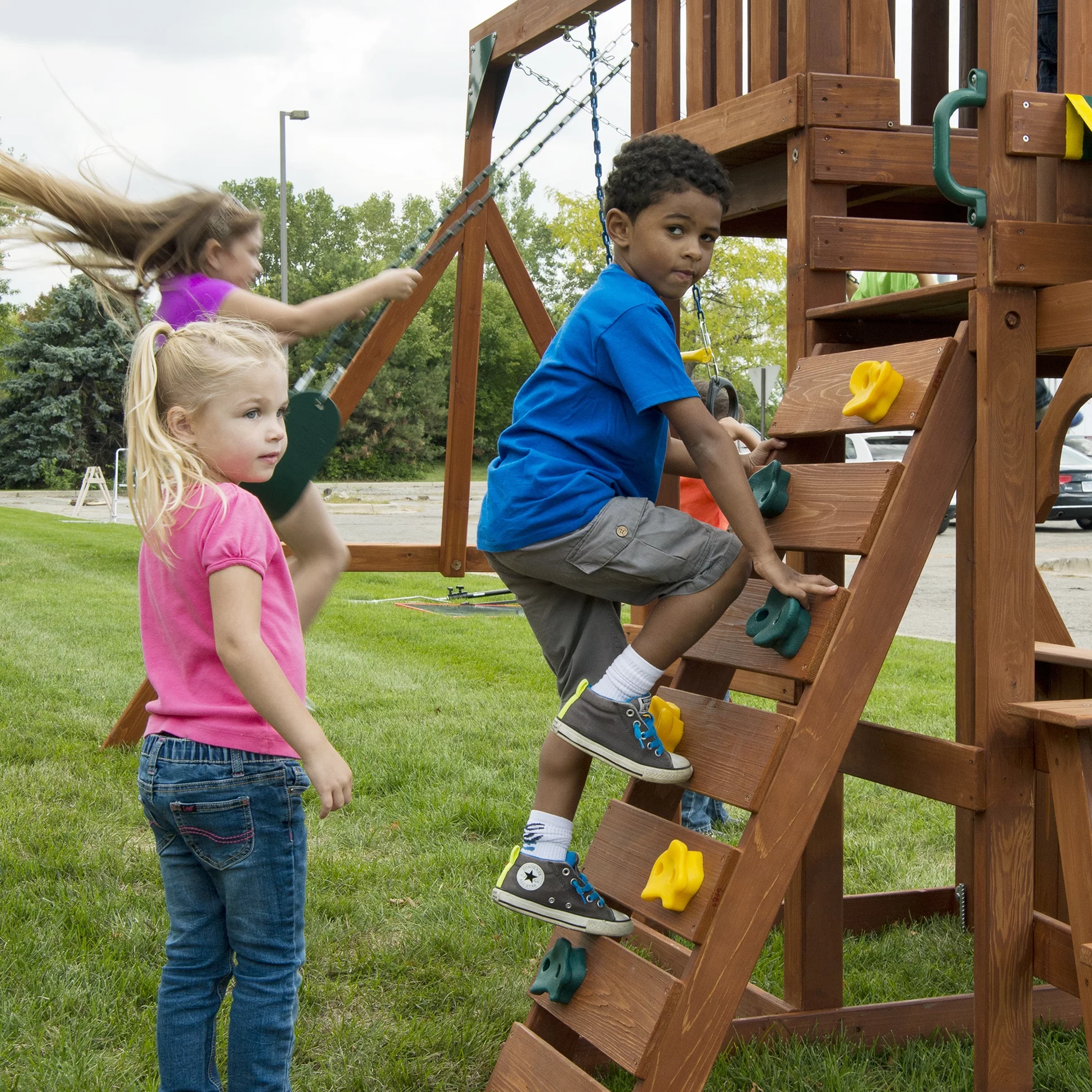 Swing-N-Slide Playful Palace Wooden Backyard Swing Set with Slide, Wood Roof, Swings, and Climbing Wall