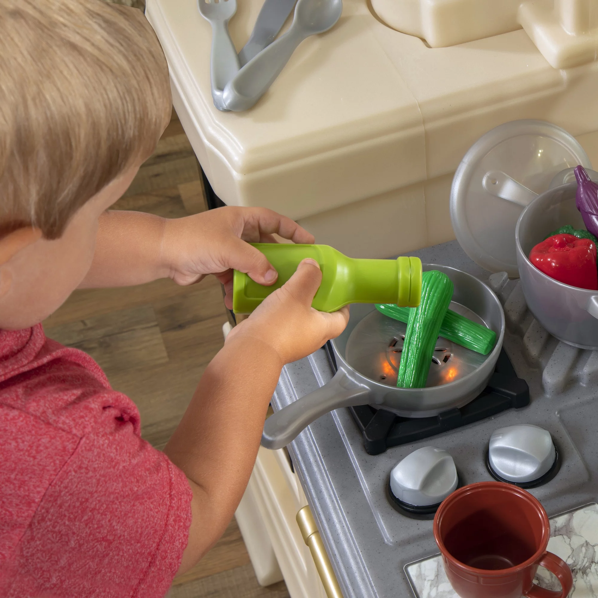 Step2 Classic Chic Kitchen includes 22 Piece Plastic Toddler Kitchen Playset