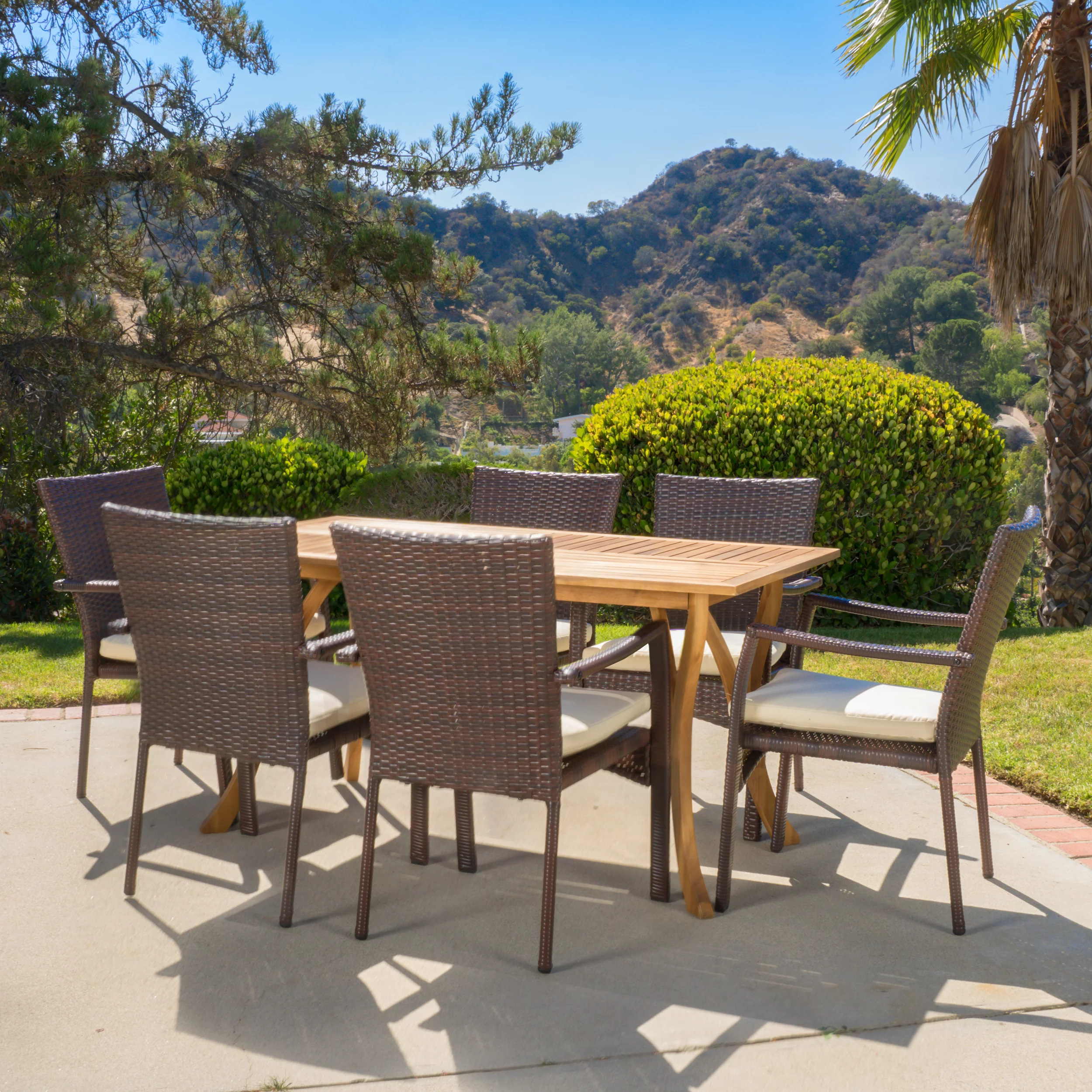 Ruiz 7 Piece Outdoor Wicker and Acacia Wood Dining Set with Cushions, Teak Finish, Creme
