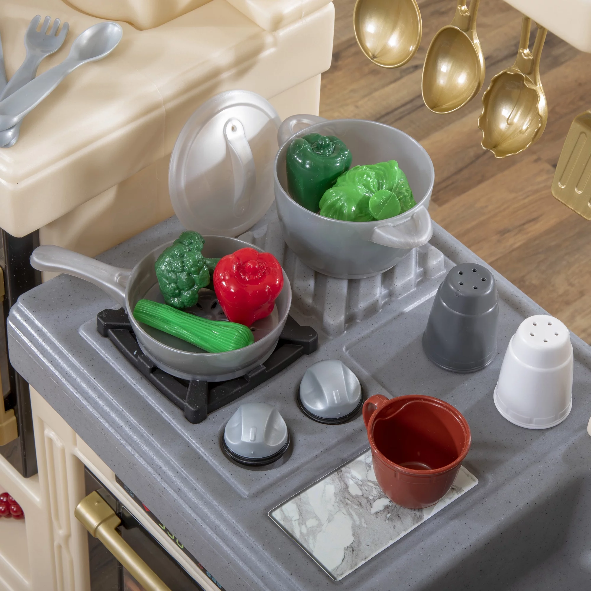 Step2 Classic Chic Kitchen includes 22 Piece Plastic Toddler Kitchen Playset