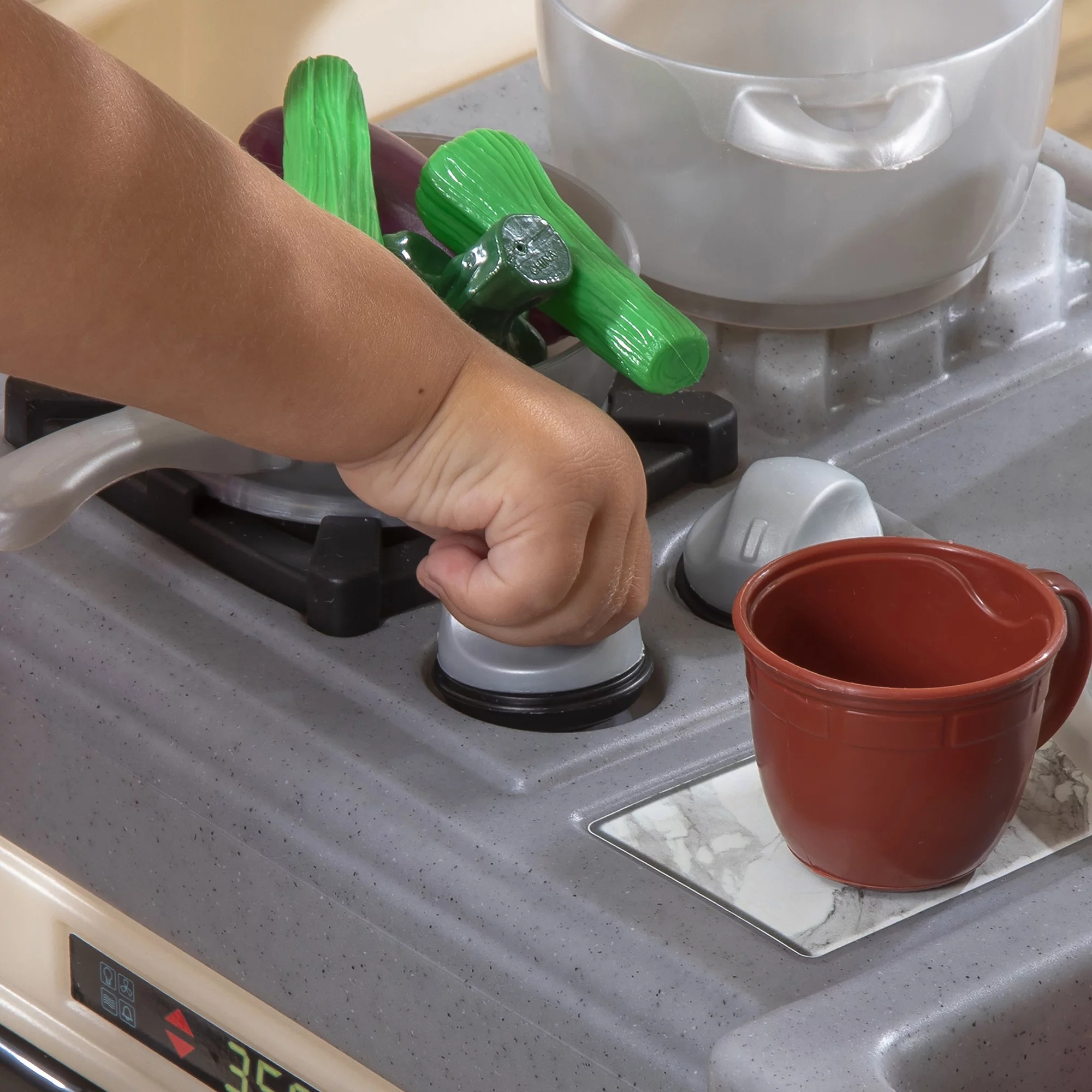 Step2 Classic Chic Kitchen includes 22 Piece Plastic Toddler Kitchen Playset