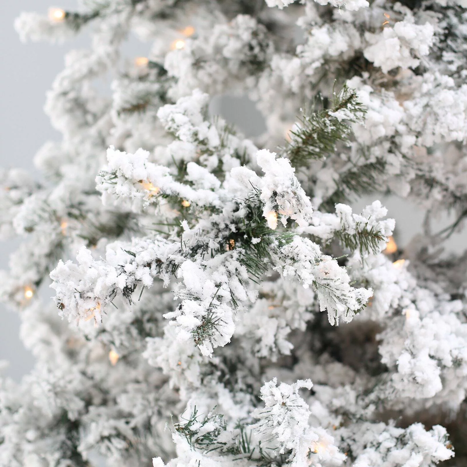 7.5 ft. Pre Lit Clear Lights Heavy Flocked Layered Spruce