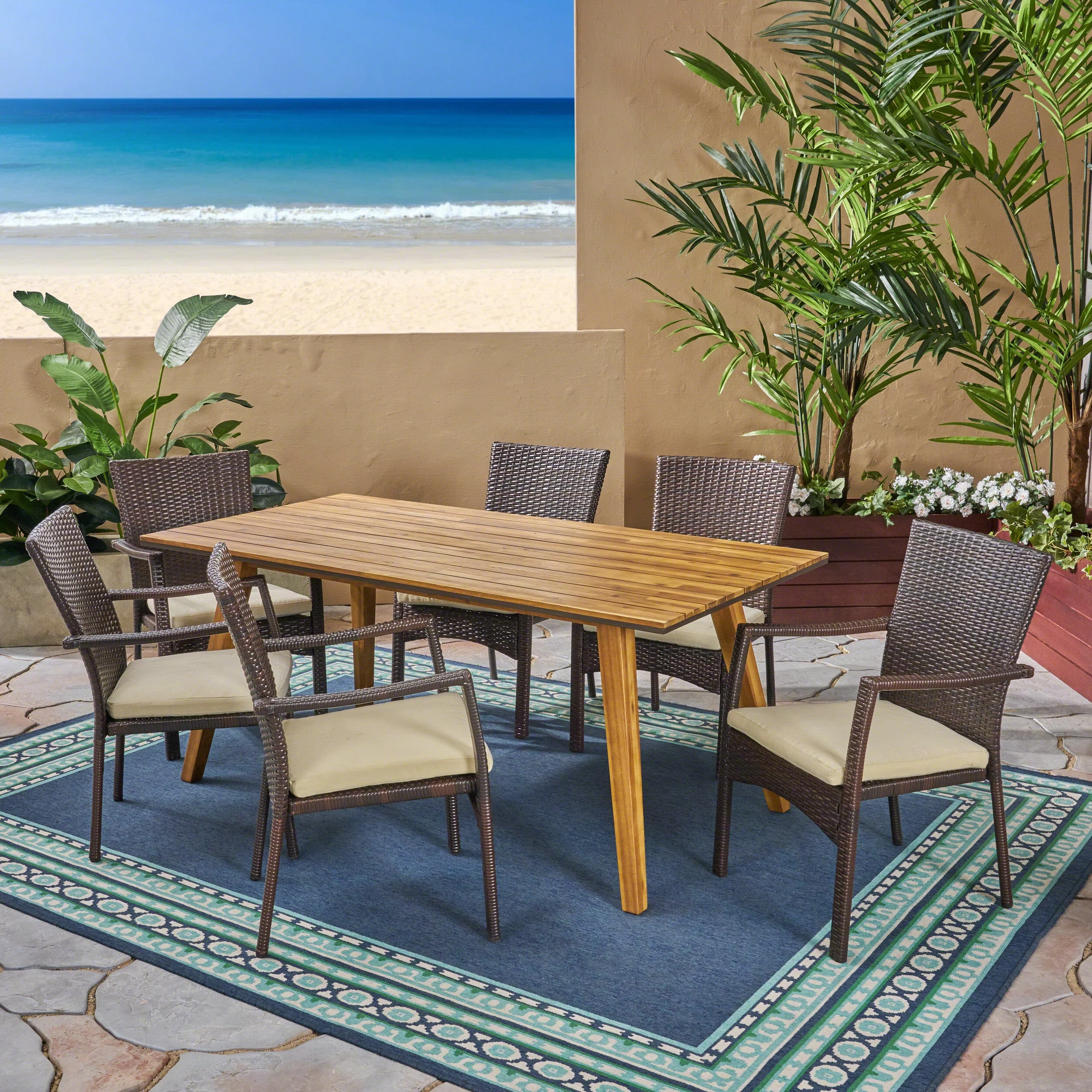 GDF Studio Goldsbys Outdoor Wicker and Acacia Wood 7 Piece Dining Set with Cushion, Teak, Brown, and Cream