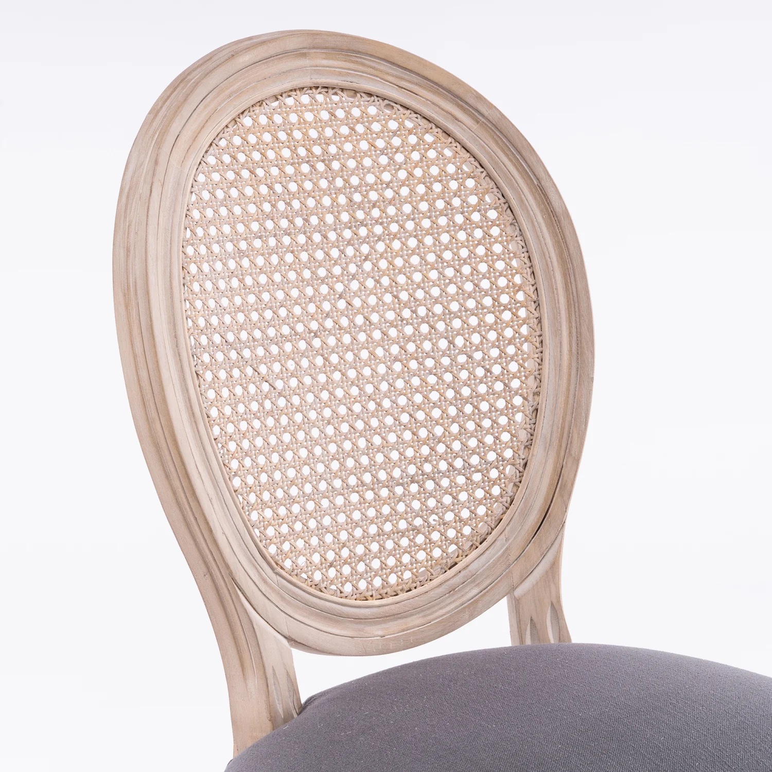 Exquisite and elegant French-style set of 2 gray linen fabric rattan back dining chairs  crafted with a solid wood frame. Perfect furniture choice for use in homes or restaurants  adding