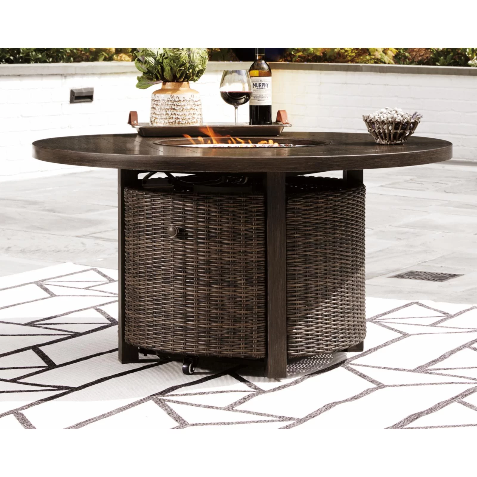 Signature Design by Ashley Paradise Trail Round Fire Pit Table in Medium Brown