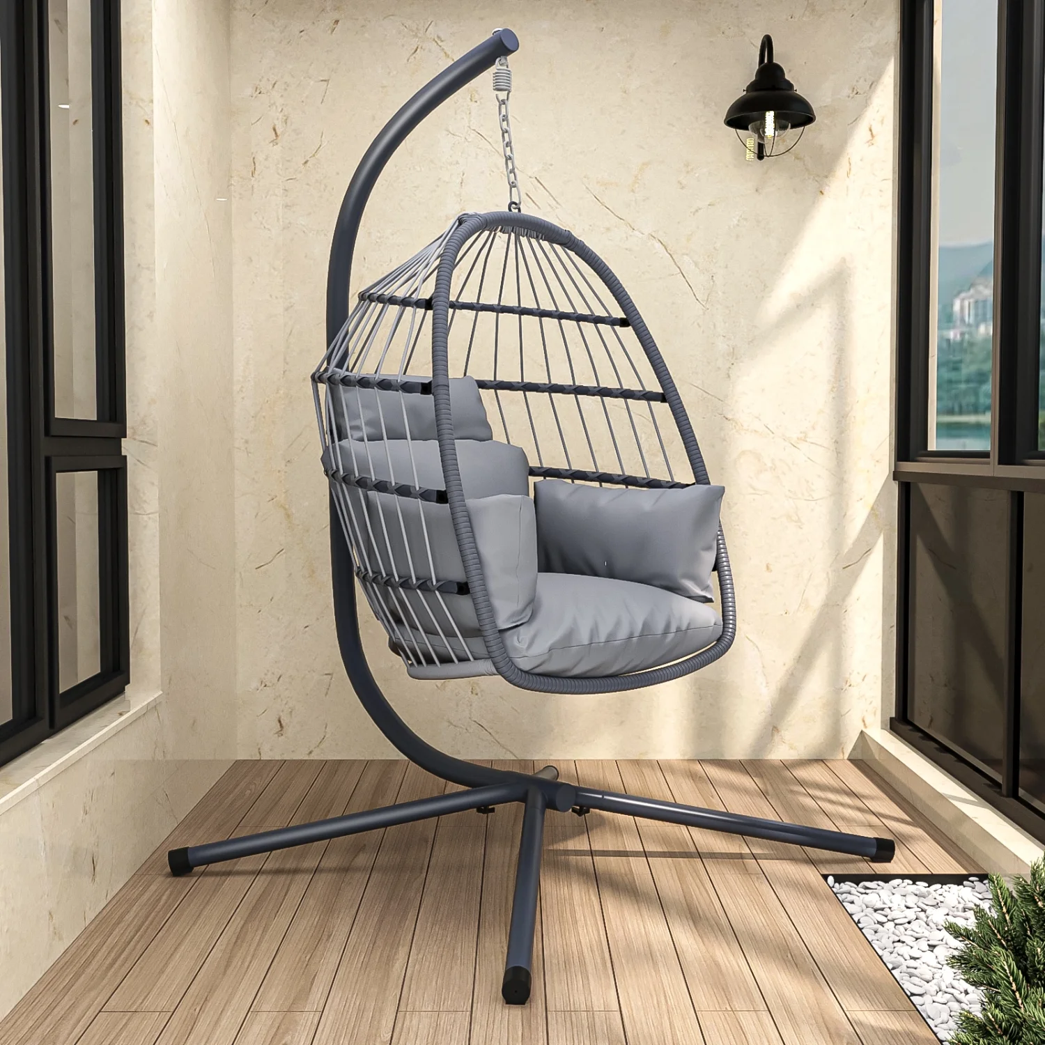 Elevate any outdoor space with this stylish and comfortable gray patio foldable hanging swing chair. Perfect for relaxing outdoors  this chair comes with a stand and can be easily folded