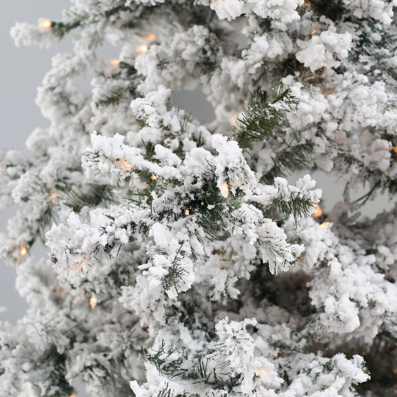 7.5 ft. Pre Lit Clear Lights Heavy Flocked Layered Spruce