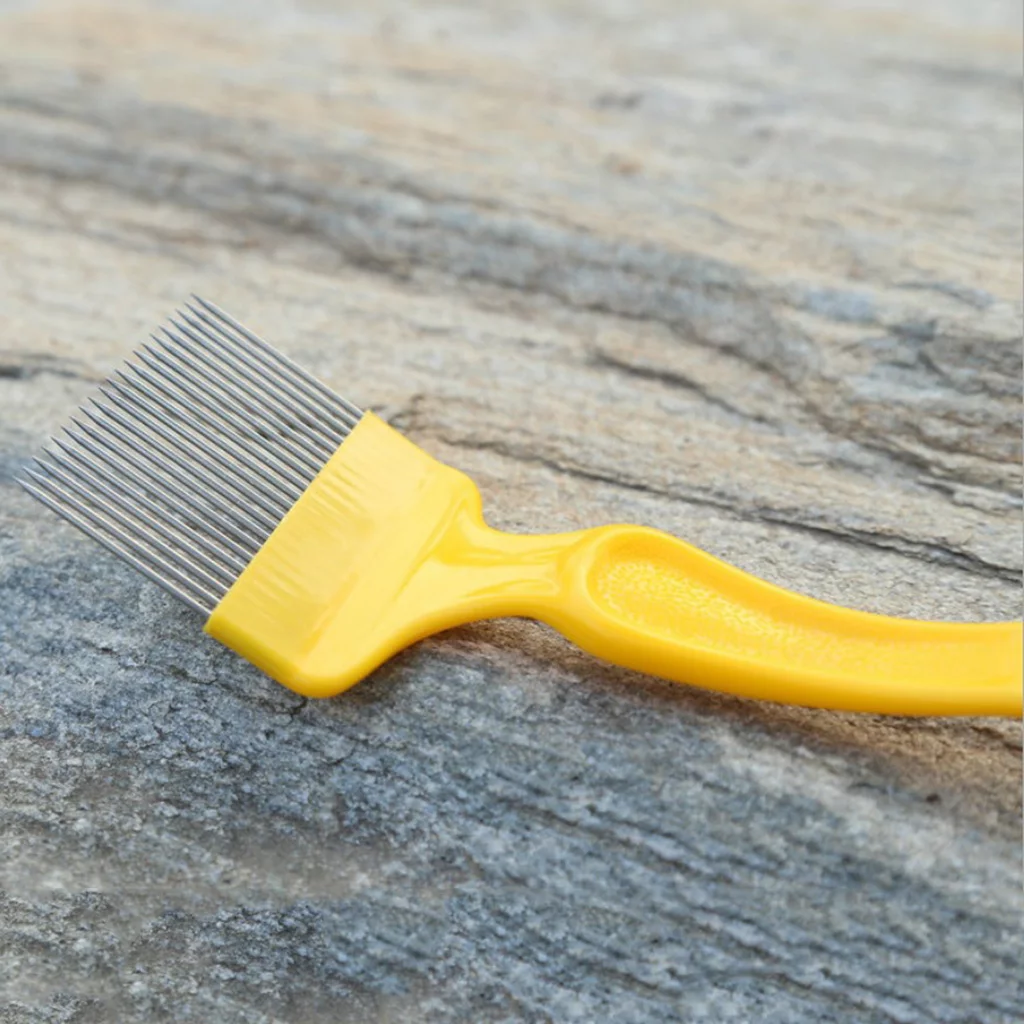Stainless steel prongs covering the fork with -pin yellow handle
