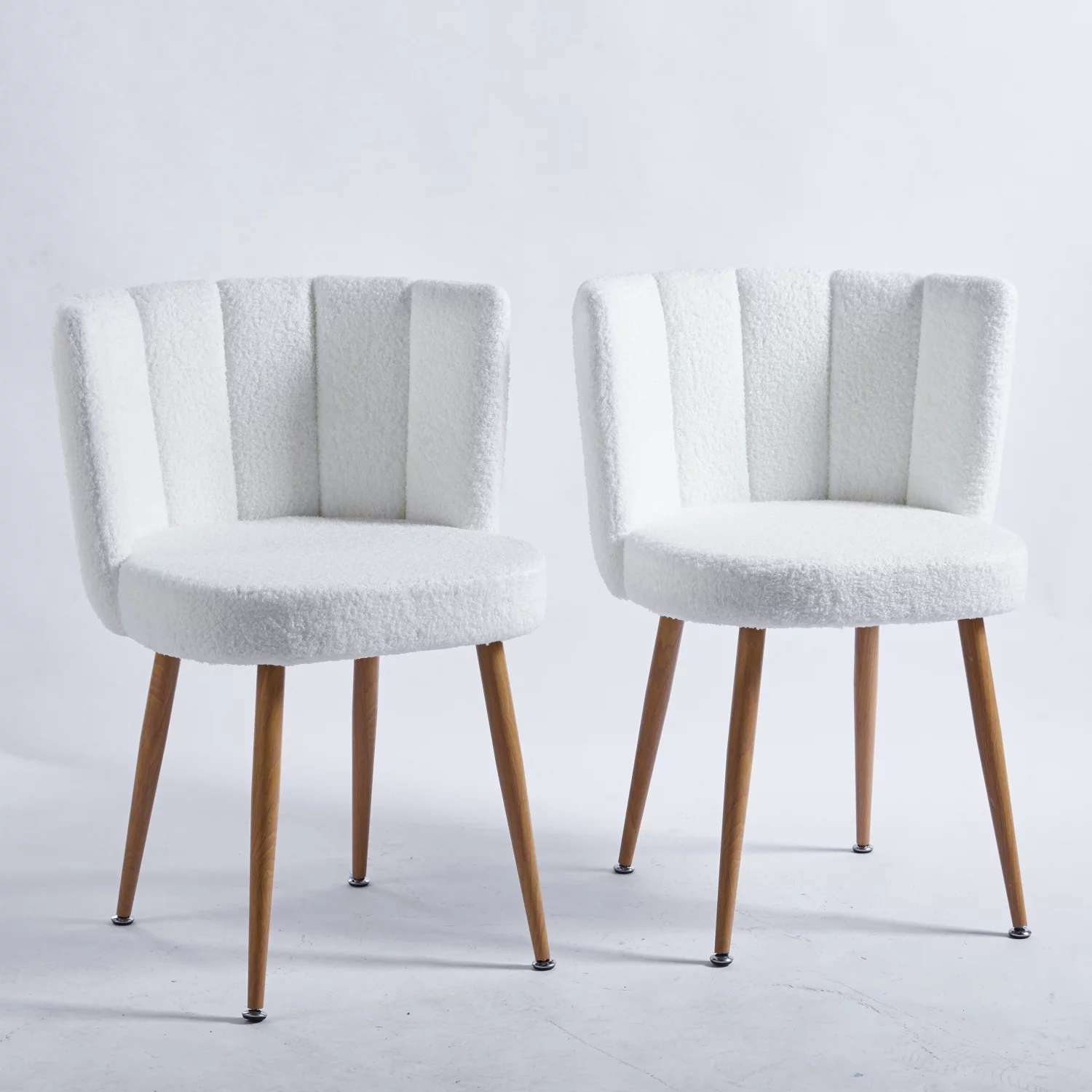 Comfortable modern white dining chairs(set of 2) with wood color iron tube legs  short hair cushions  and relaxing backrest. Ideal for dining room  living room  or cafe. Simplistic design